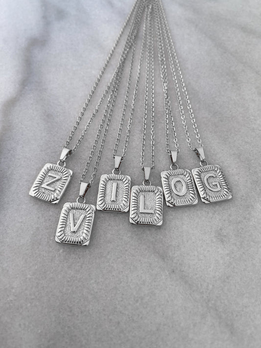 Classic initial necklaces in silver